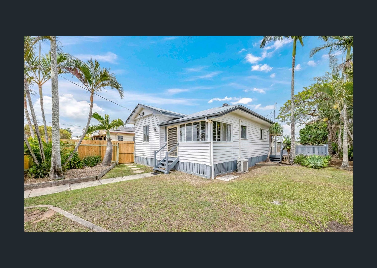 A second view of the client’s property showing the side of the house and yard